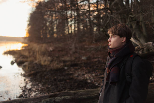istock Portrait of a young man walking in forest alone 1249883846