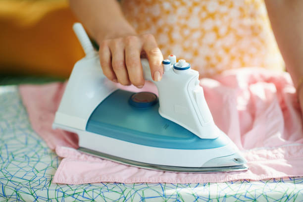 istock female in house in sunny day ironing on ironing board 1249884501