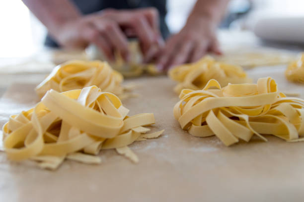 istock Woman making homemade pasta closeup 1249884531