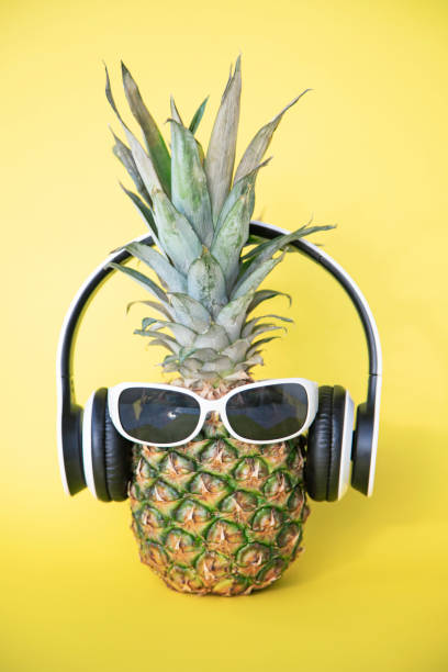 istock Pineapple with headphones and sunglasses 1249886817