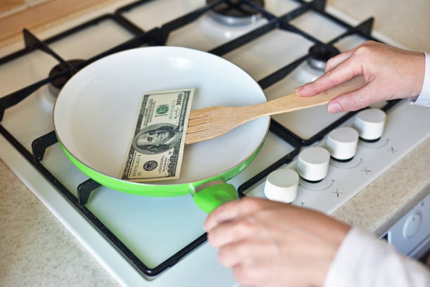 istock money is fried in a pan 1249886860