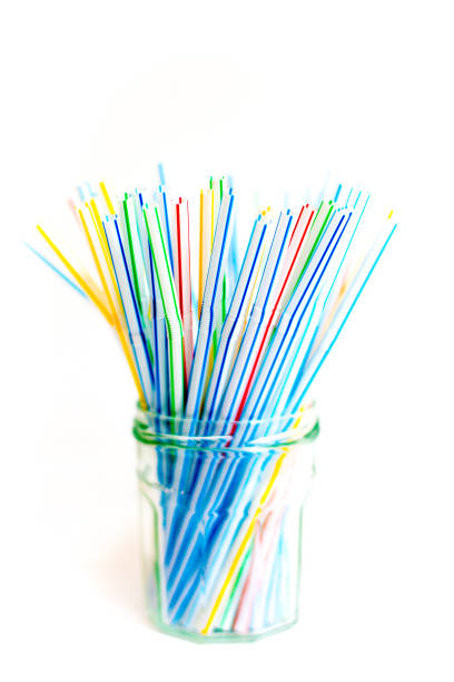 istock Plastic Straws in Glass Jar, White Background 1249889065