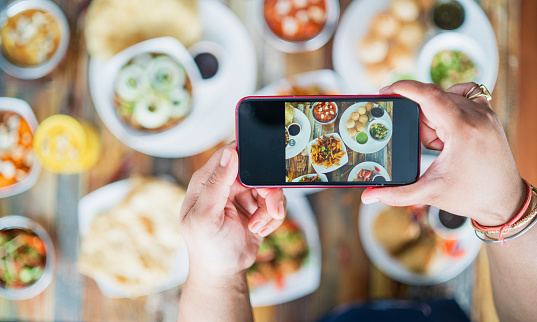 Photographing food on phone.