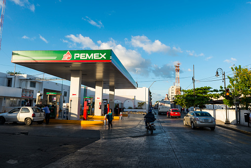 Mérida, Mexico - November 27, 2014: A car fuels up at a Pemex gas station in Mérida, the capital of the Mexican state of Yucatán. Pemex (or Petróleos Mexicano, which translates to Mexican Petroleum) is a Mexican state-owned petroleum company.