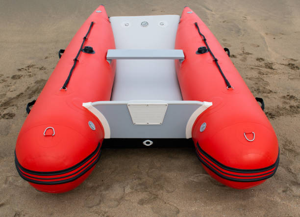 istock Inflatable boat on the beach red in color 1249897560