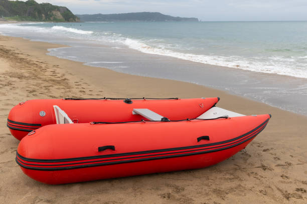 istock Inflatable boat on the beach red in color 1249897569