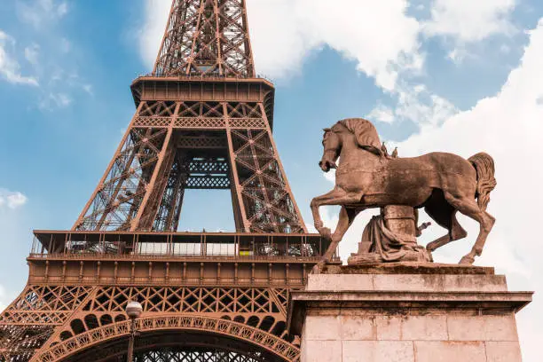 Photo of Eiffel tower with horse statue