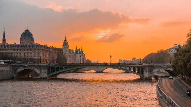 Photo of Sunset river sena paris, with boats and bridges in the background
