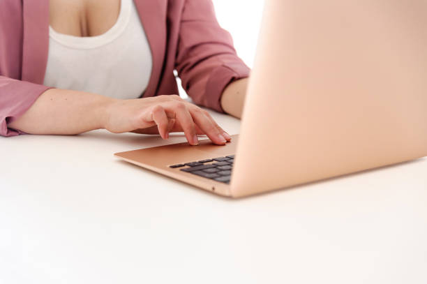 istock Woman working on her gold laptop 1249899563