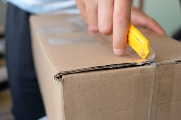 istock A man opening a postal box with a cutter at his home 1249900928