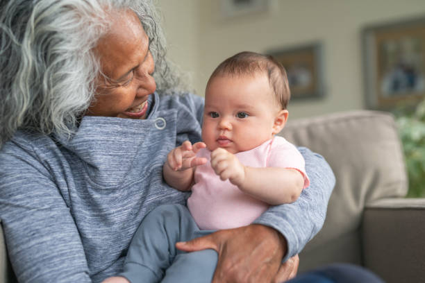 istock Playful baby making her grandmother laugh 1249904171