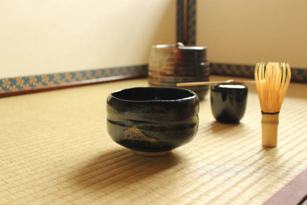 istock Making matcha green tea with pottery tea cup and bamboo whisk 1249904467