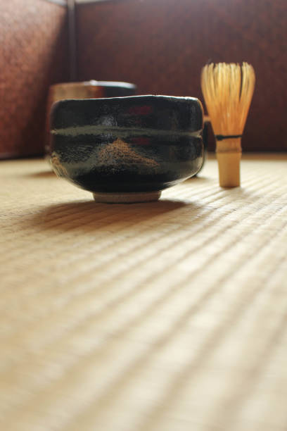 istock Making matcha green tea with pottery tea cup and bamboo whisk 1249904546