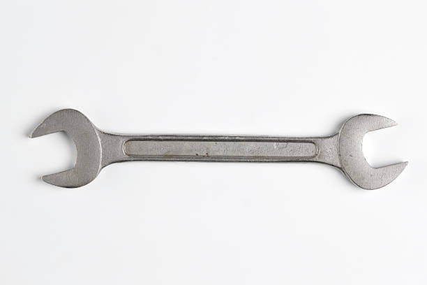 Wrench isolated on White Background. Top View of Stainless Steel Wrench with Real Shadow. Copy Space for Text or Image hammer wrench stock pictures, royalty-free photos & images