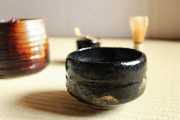 istock Making matcha green tea with pottery tea cup and bamboo whisk 1249904618