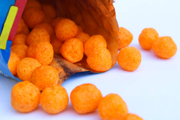 istock Tasty cheese balls dropped from a packet 1249906064