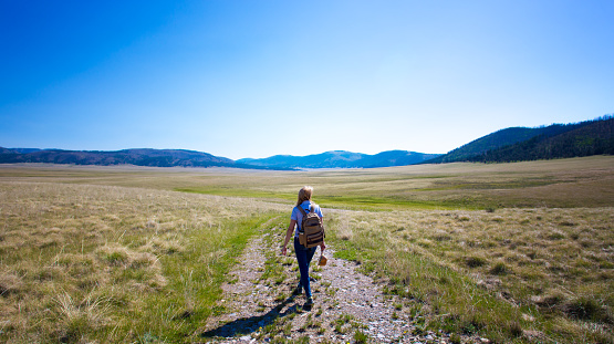 Woman Walking Alone in Valles Caldera Wilderness
