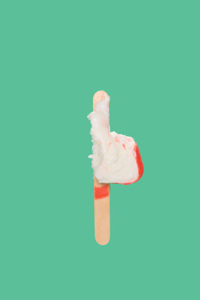 istock red chocolate outer popsicle with the last bit on green background 1249908774