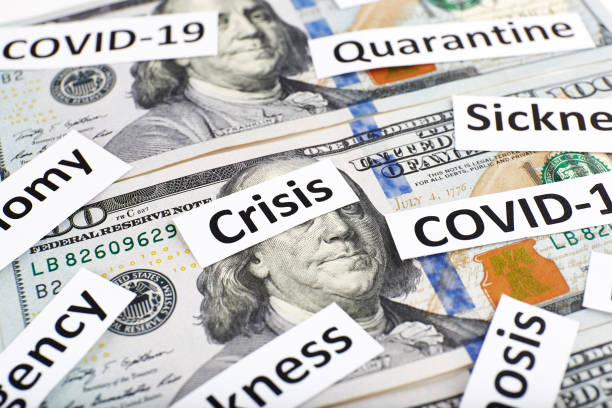 istock Coronavirus, COVID-19 headline clippings on 100 USD banknotes 1249909816