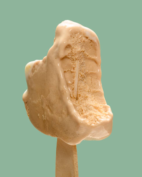 istock cheese and lemon flavor popsicle with the last bit on green background 1249909818