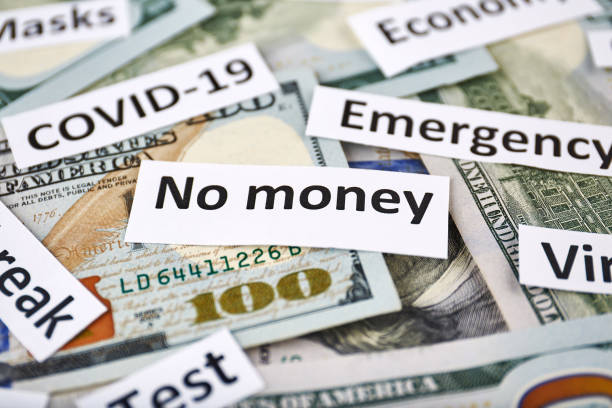 istock Coronavirus, COVID-19 headline clippings on 100 USD banknotes 1249909918