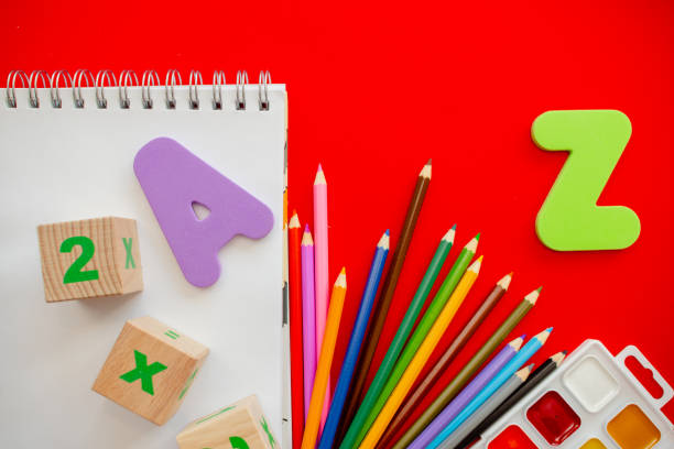 istock Back to school colorfull flatlay. Pencils notepad numbs a b c alphabet waterolors. 1249910625