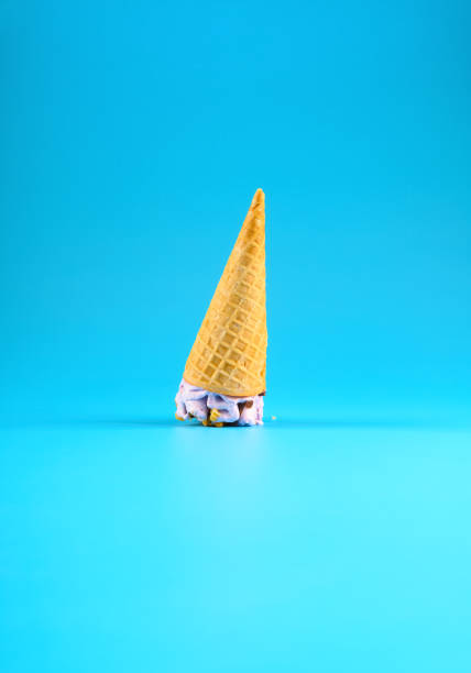 istock side view sweet potato flavor ice cream cone stands upside down on blue background 1249912306