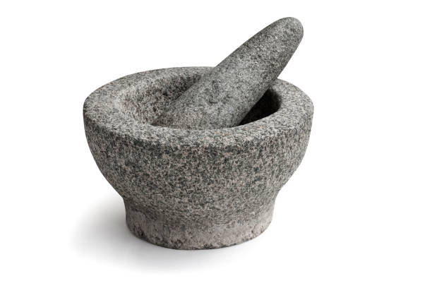 istock Stone mortar and pestle isolated on white background 1249913349
