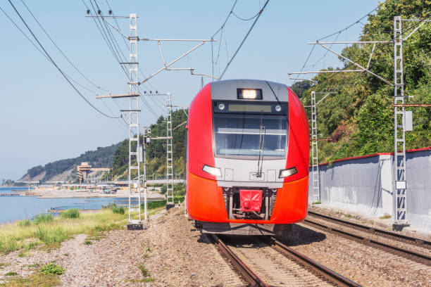 istock Passenger train moves along the sea coast. Sochi. 1249920567