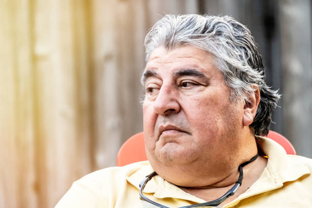 serious mature senior man looking away - portrait human face men overweight imagens e fotografias de stock