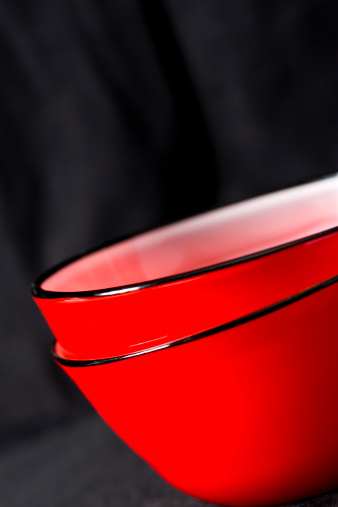 Contemporary design red bowls on a black background