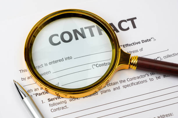 istock Pen, magnifier and contract. Profitable business contract concept. 1249944501