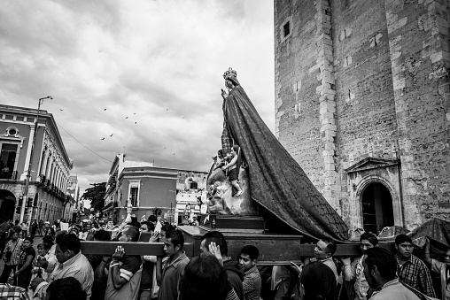 Mérida, Mexico - November 27, 2014: A procession carrying the Virgin Mary departs the Cathedral of Mérida on the anniversary of the coronation of Our Lady of Yucatan.