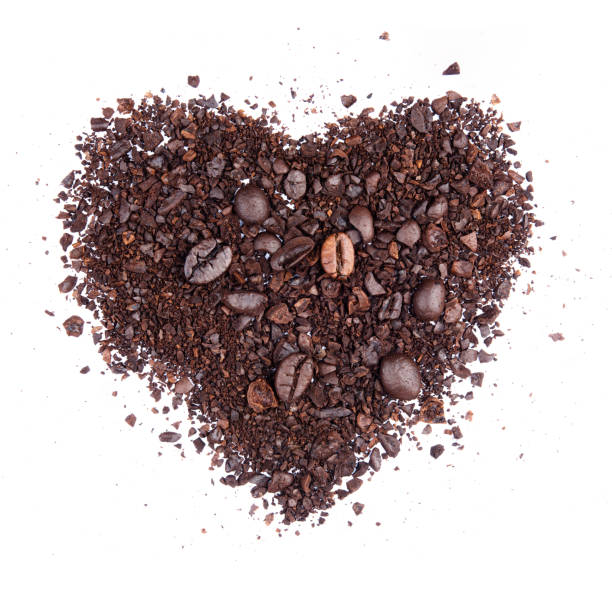 istock Coffee bean broken crushed splash isolated on white background top view heart shape object photo hi resolution 1249945869