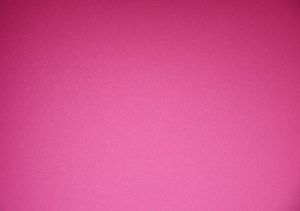 istock A bright pink monochrome rough surface with vignetting along the edges and a gradient from below. 1249950701