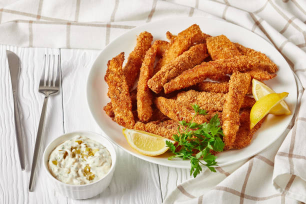 istock fish sticks, fish fillet fingers breaded and deep-fried 1249950710