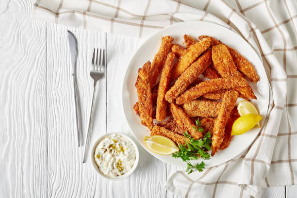 istock fish sticks, fish fillet fingers breaded and deep-fried 1249950717