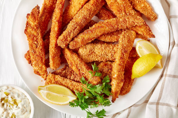 istock fish sticks, fish fillet fingers breaded and deep-fried 1249950718