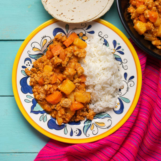 istock Mexican picadillo with rice on turquoise background 1249951086