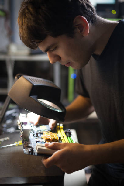 istock Young technician working with motherboard for donating purposes 1249955616