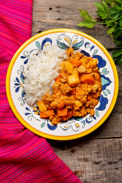 istock Mexican picadillo with rice on wooden background 1249956681