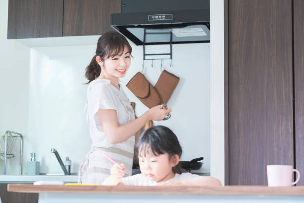 istock A girl drawing in the kitchen 1249959183