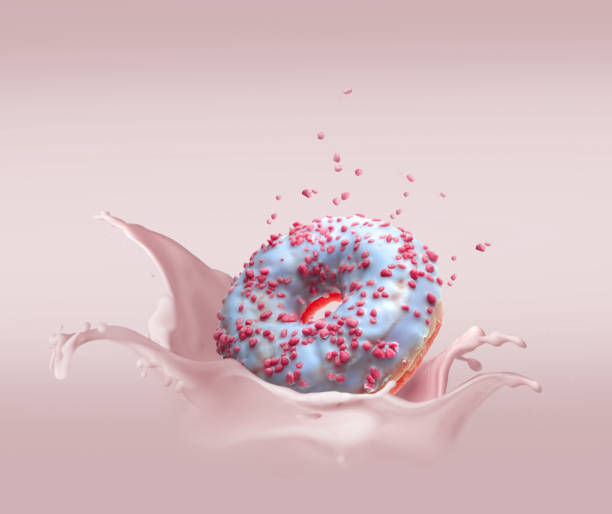 istock Donut dropped in cream with splash and flying particular 1249960058