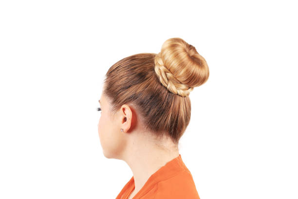 Beautiful woman with creative elegant hair bun. Beautiful woman with creative elegant hair bun. Isolated in a white background. Close-up. braided buns stock pictures, royalty-free photos & images