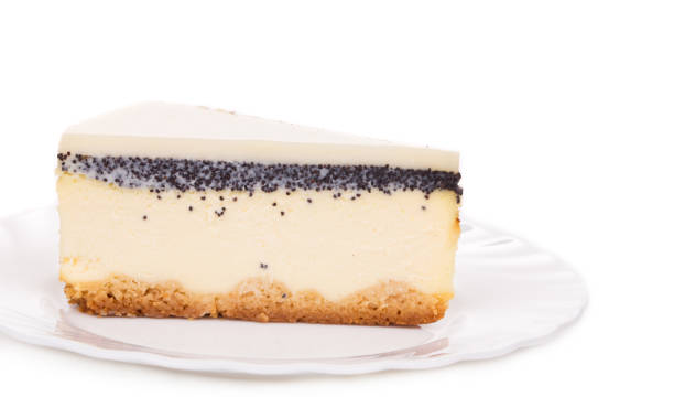 A slice of vanilla cheesecake on a white plate.