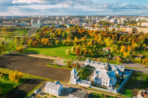 Photo of Mahiliou, Belarus. Mogilev Cityscape With Famous Landmarks - Church of Saints Boris and Gleb, and Church of the Exaltation of Holy Cross. Aerial View Of Skyline In Autumn Day. Bird's-eye View