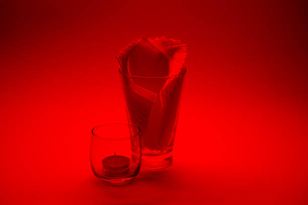 Decorate on white background. Tissue in a glass on an orange background.