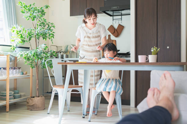 istock A girl drawing in the kitchen 1249961338