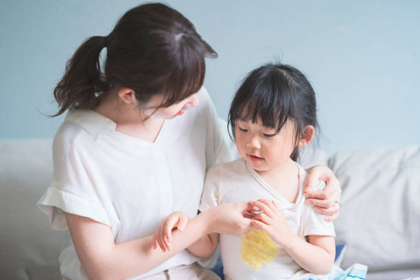 istock Asian girl measuring body temperature 1249961432