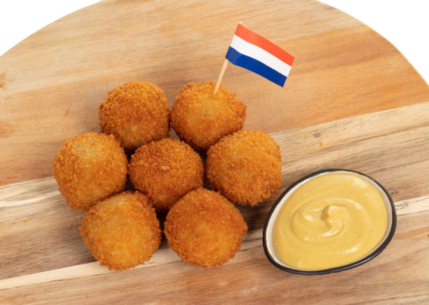 istock Dutch traditional snack bitterbal on a serving board, dutch flag, isolated 1249963851